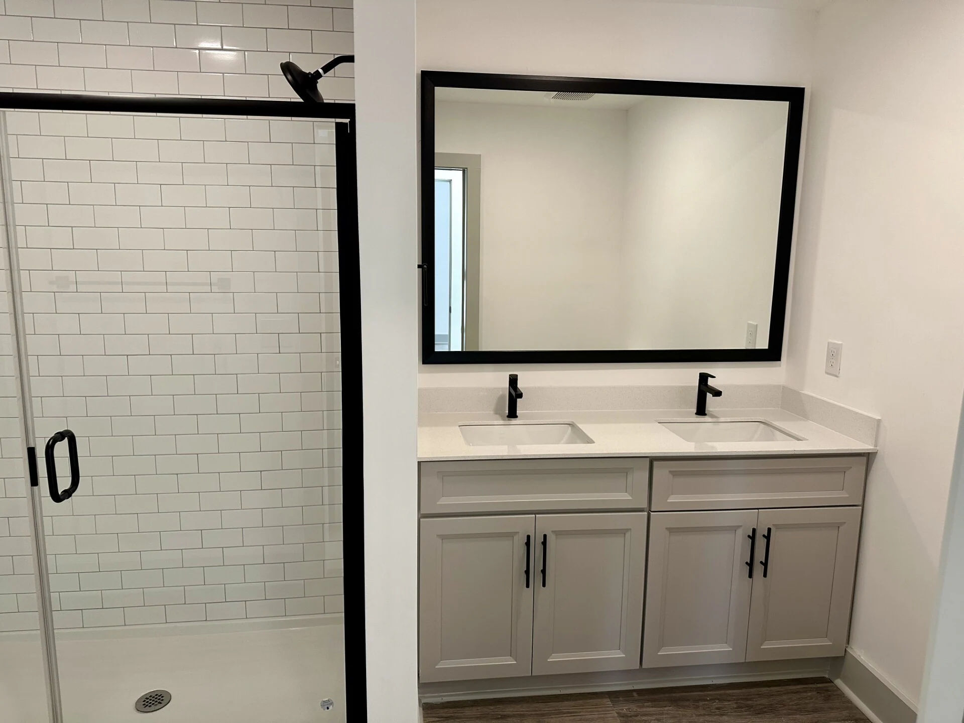Bathroom with a double vanity and walk-in shower